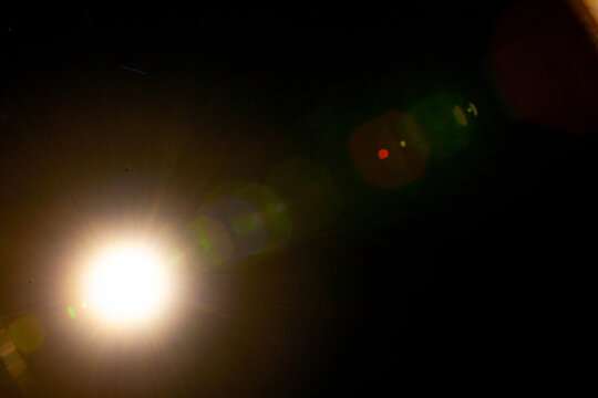 Sun flare on the black background