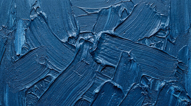 Close-up of textured blue paint with abstract brush strokes