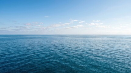 Fototapeta premium vast open blue sea surface stretching calm towards the horizon