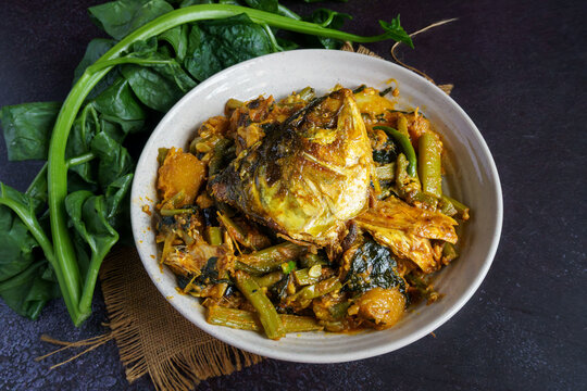 Ilish Macher Matha Diye Pui Shaker Ghonto Traditional Bengali Hilsa Fish Head with Malabar Spinach Curry Served in a Bowl