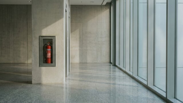 Architecture - Modern office corridor with concrete pillar and large windows