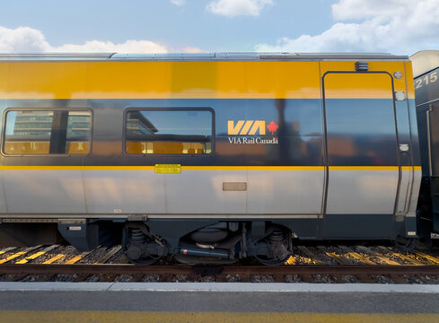 Ottawa, Ontario, Canada. August 21, 2026. Side view of VIA Rail Canada train car at train station platform.