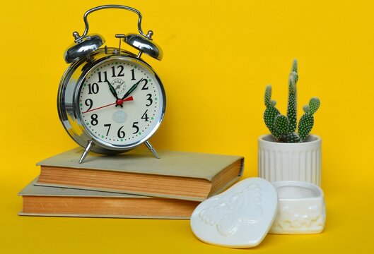alarm clock and books