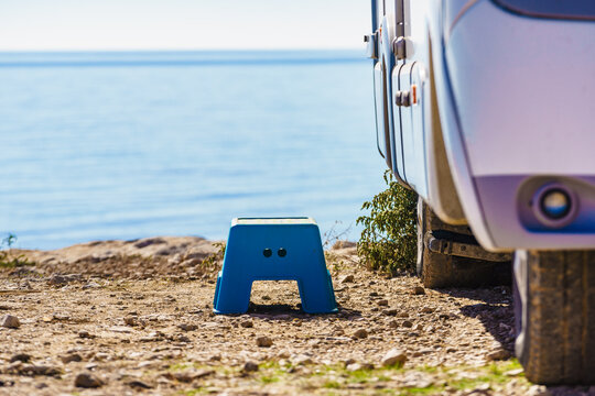 Folding step stool at camper car on camping on sea shore