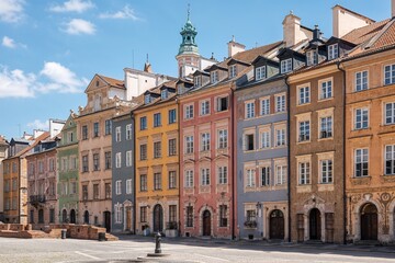 Fototapeta premium Colorful historic buildings in Warsaw old town under blue sky 
