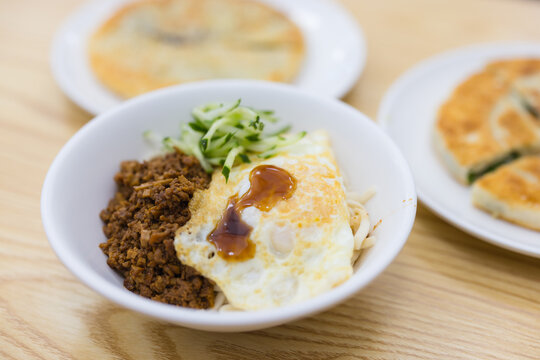Bowl of traditional asian noodles with toppings