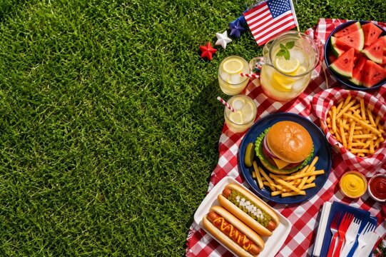 Fourth of July picnic with burgers hot dogs and American flag