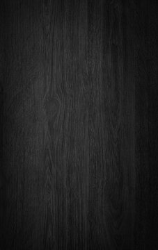 Black wood dark texture background. Top view of wooden grain pattern.