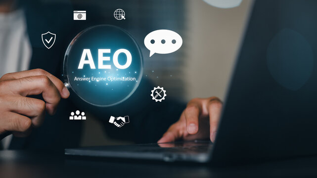 A person interacting with a digital interface displaying AEO Authorized Economic Operator and related icons on a laptop, symbolizing technology, online communication, and innovation.
