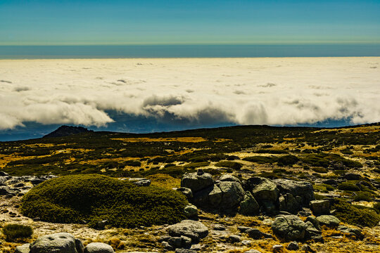 Clouds above mountain. Serra da Estrela in Portugal. Torre peak.
