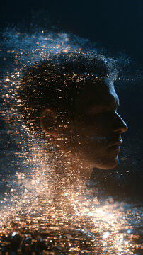 Ethereal digital transformation of a man's profile dissolving into a swarm of glowing gold and blue light particles