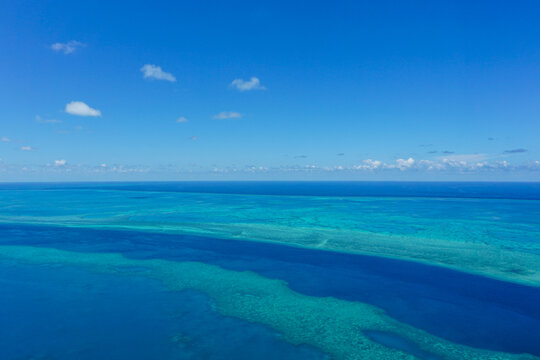 Great Barrier Reef aerial view showing turquoise ocean water