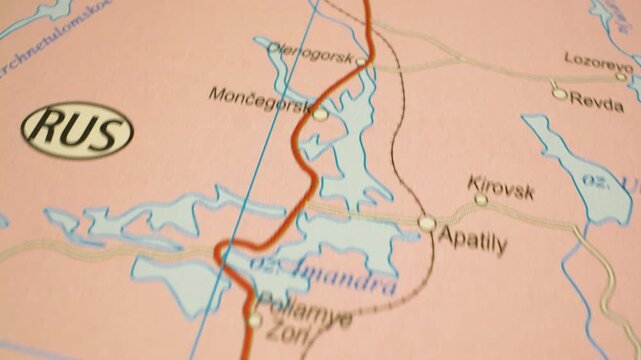 Gliding camera view over atlas map panning to Murmansk, Russia