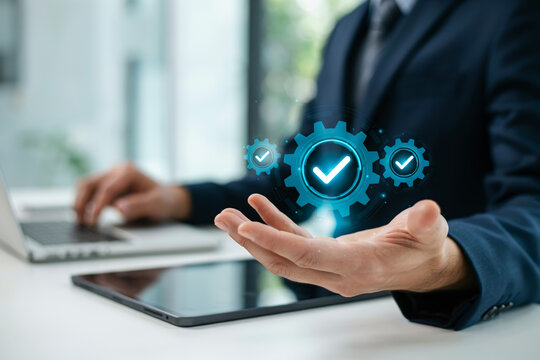 Business person showing digital gears with checkmarks symbolizing effective operational management and successful quality control processes.