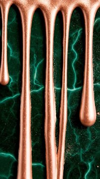 Rose Gold Metallic Liquid Paint Drips Over a Textured Emerald Green Marble Surface with Electric Vein Patterns