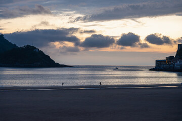 Fototapeta premium Golden Sunset over La Concha Bay and Beach in San Sebastian, Basque Country, Spain