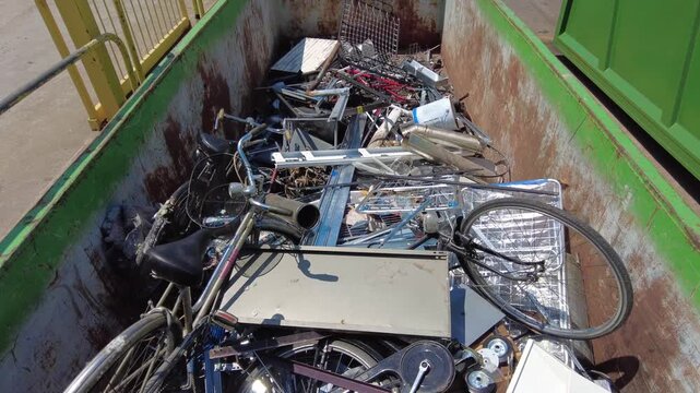 Europe, Italy, Milan: municipal sorted waste collection in Recycling and Waste Drop-off Center&mdash;RAE and household waste (glass, plastic, appliances, iron, paper, wood) separated for recycling at an Ams