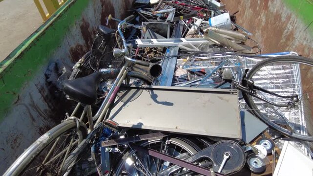 Europe, Italy, Milan: municipal sorted waste collection in Recycling and Waste Drop-off Center&mdash;RAE and household waste (glass, plastic, appliances, iron, paper, wood) separated for recycling at an Ams