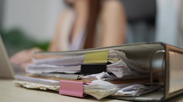 Pile of Office Paperwork Showing Administrative Workload and Document Backlog