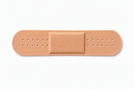 Beige adhesive bandage strip on pure white medical copy space background