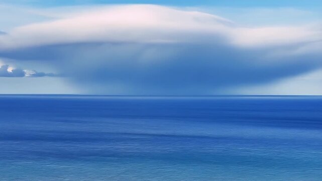 Giant Cloud Vortex Forming Over Calm Ocean Water, Dynamically Swirling and Evolving in a Mesmerizing Timelapse Sequence.