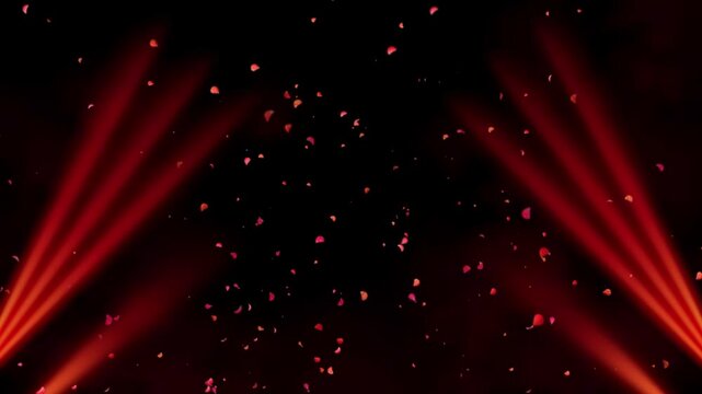 Purple heart shaped fireworks display with red light beams against a dark night sky background with video heart firework explosion surrounded red spotlights dark sky pyrotechnics celebration bright