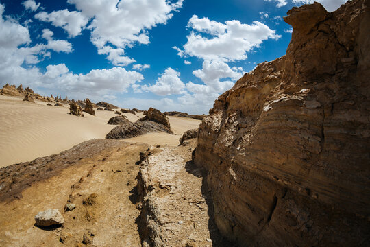 Aerial view of landscape in desert under blue sky