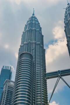 
KUALA LUMPUR, MALAYSIA - SEPTEMBERER 14, 2025: Petronas Towers. Petronas Towers, also known as Menara Petronas is the tallest buildings in the world from 1998 to 2004. On a hot day during wet season.