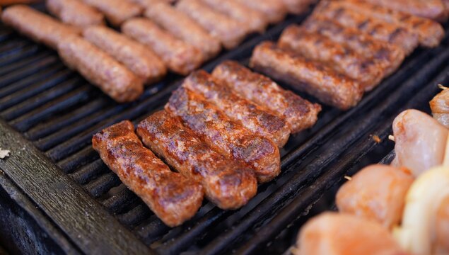Traditional Romanian Mici Grilling at a Street Food Festival