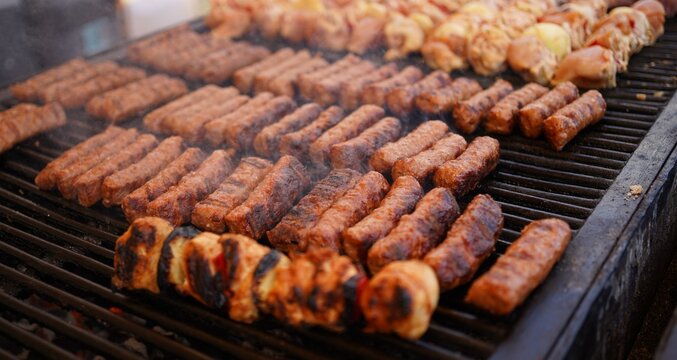 Traditional Romanian Mici Grilling at a Street Food Festival