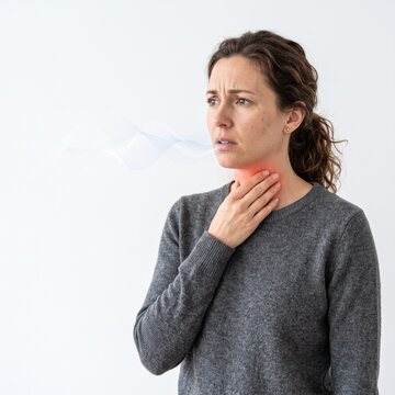 Sick woman suffering from sore throat or laryngitis holding her neck with red pain glow and breath wave