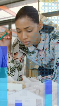 Animation of statistical data processing over african american female engineer working on model