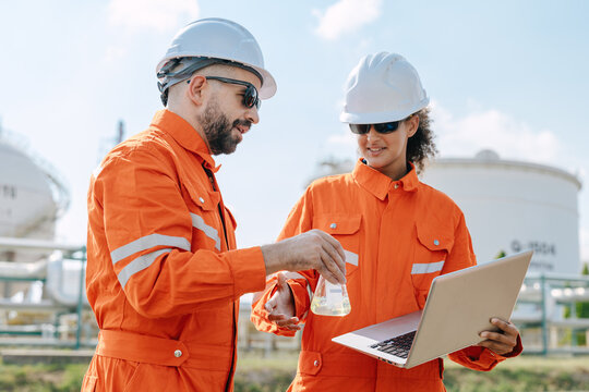 Refinery Technician Engineer Team Chemical Oil Checking Sample Laptop Outdoor Industrial Plant Site.