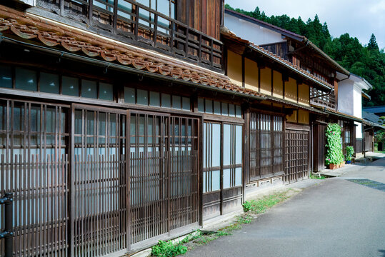 Traditional Wooden Townhouses Along a Historic Street in Omori Town