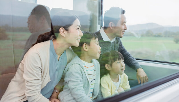 Family Enjoying Scenic Train Journey Together
