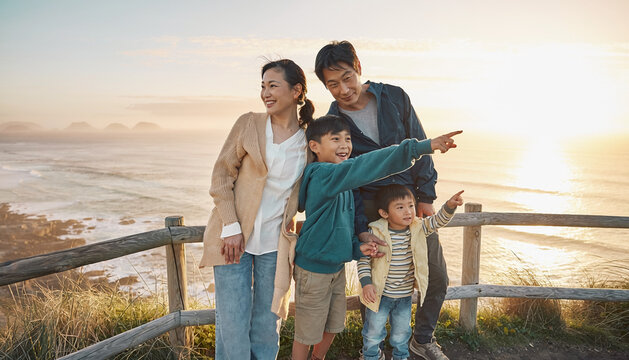 Happy Family Enjoying a Scenic Sunset by the Ocean