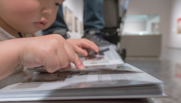 Young Child Exploring Art in a Gallery Setting
