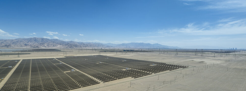 Panoramic Aerial View of Vast Solar Power Plant in Arid Gobi Desert Landscape
