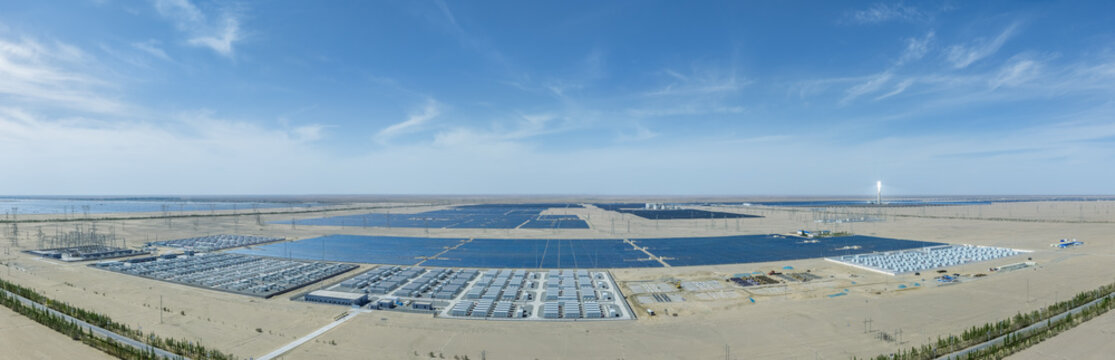 Panoramic View of Large-Scale Battery Energy Storage Power Stations, Solar Arrays and Thermal Tower in Gobi Desert