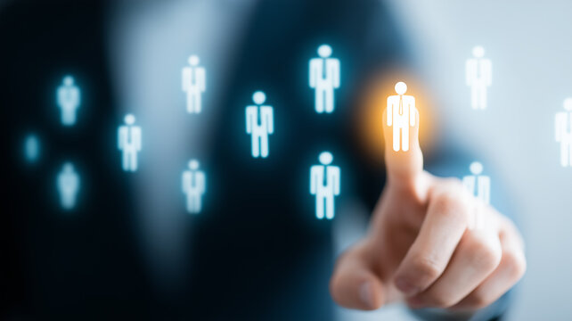 A hand selects one professional from a group representing recruitment candidate selection leadership choice and human resources management
