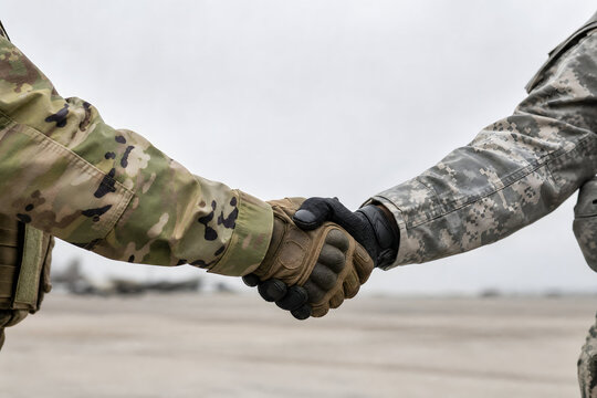 International alliance soldier to soldier handshake military partnership
