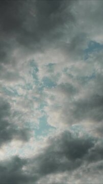time-lapse through a cloudy sky with white puffy clouds