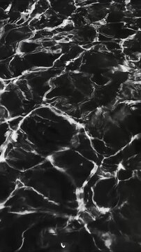 A serene black and white  of a body of water, ideal for use in travel or nature-themed projects