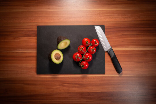 Avocado Tomatoes and Knife in Overhead Kitchen Scene