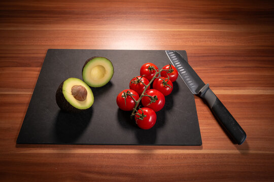 Avocado and Vine Tomatoes with Chef Knife from Above