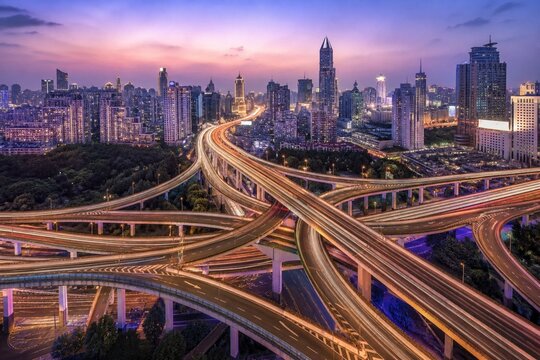 Smart City Highway Interchange Light Trails Under Violet Blue Hour Sky