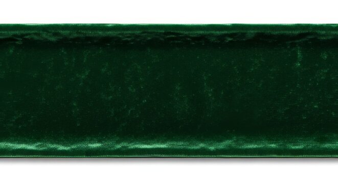 Dark green velvet fabric texture backdrop showing rich deep color and soft light reflection on luxurious textile material surface.