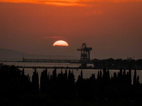 Orange sunset over Ploce harbor and Adriatic coast