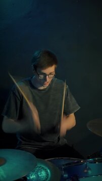 Vigorous drumming session with sharp hits and emotional intensity