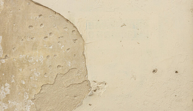 Old crumbling plaster wall texture creating abstract background